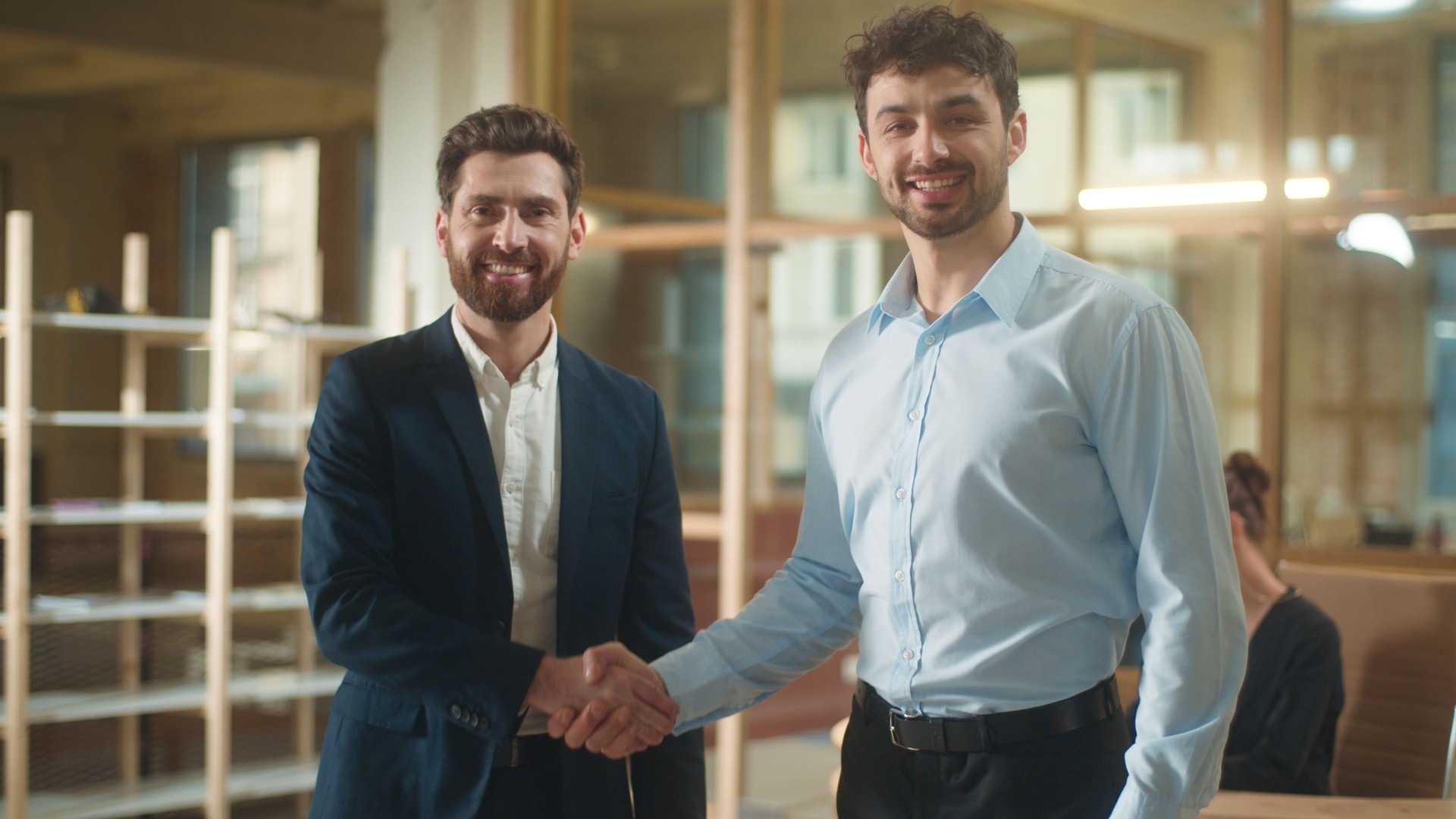 Business men shaking hands handshake in office two smiling businessmen shake arms guys agreement deal contract cooperation welcome greeting male partnership partners handshaking hire candidate recruit